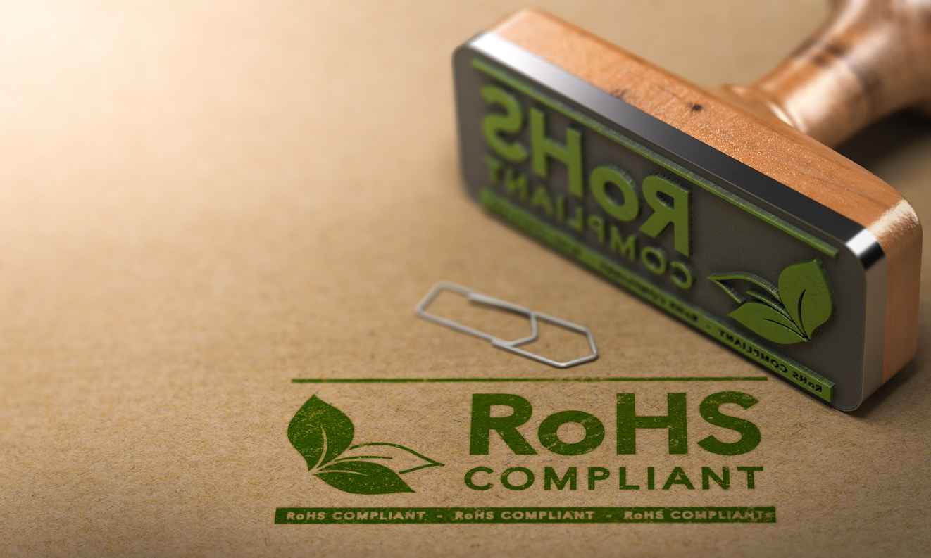 3D illustration of a rubber stamp with the text RoHS Compliant stamped on paper background.