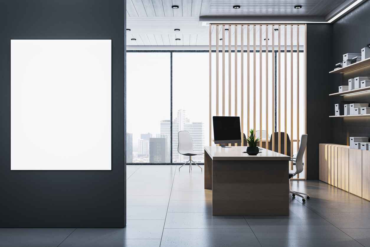 Contemporary executive office with luxury desk, vertical mockup poster on dark wall, and modern interior design in high-rise background. 3D Rendering