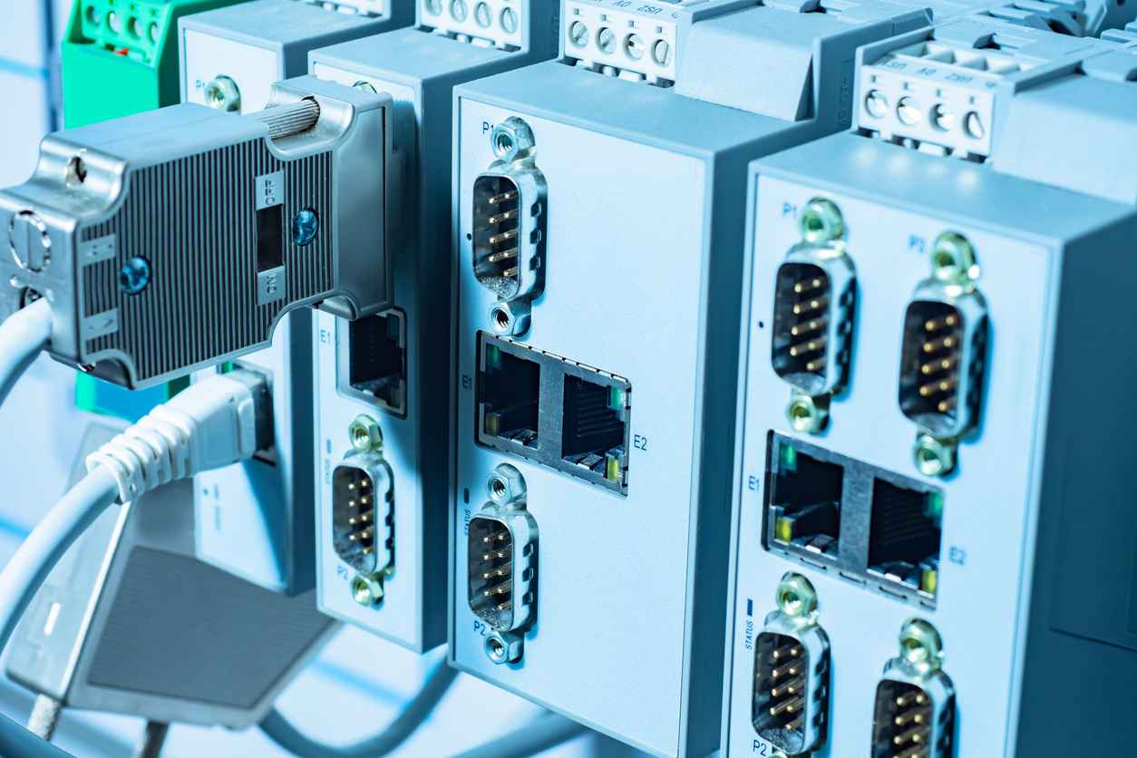 Embedded computer in industrial equipment. Network component of industrial equipment. Fragment of a network block of machine. Wires are connected to block. Concept - industrial equipment control unit